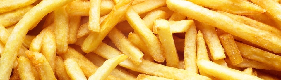 A large portion of fresh french fries. 